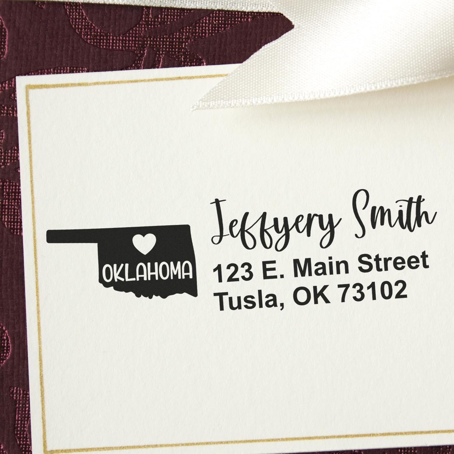 Custom return address rubber stamp with Oklahoma state icon, Jeffrey Smith, and Tulsa mailing address on cream stationery.