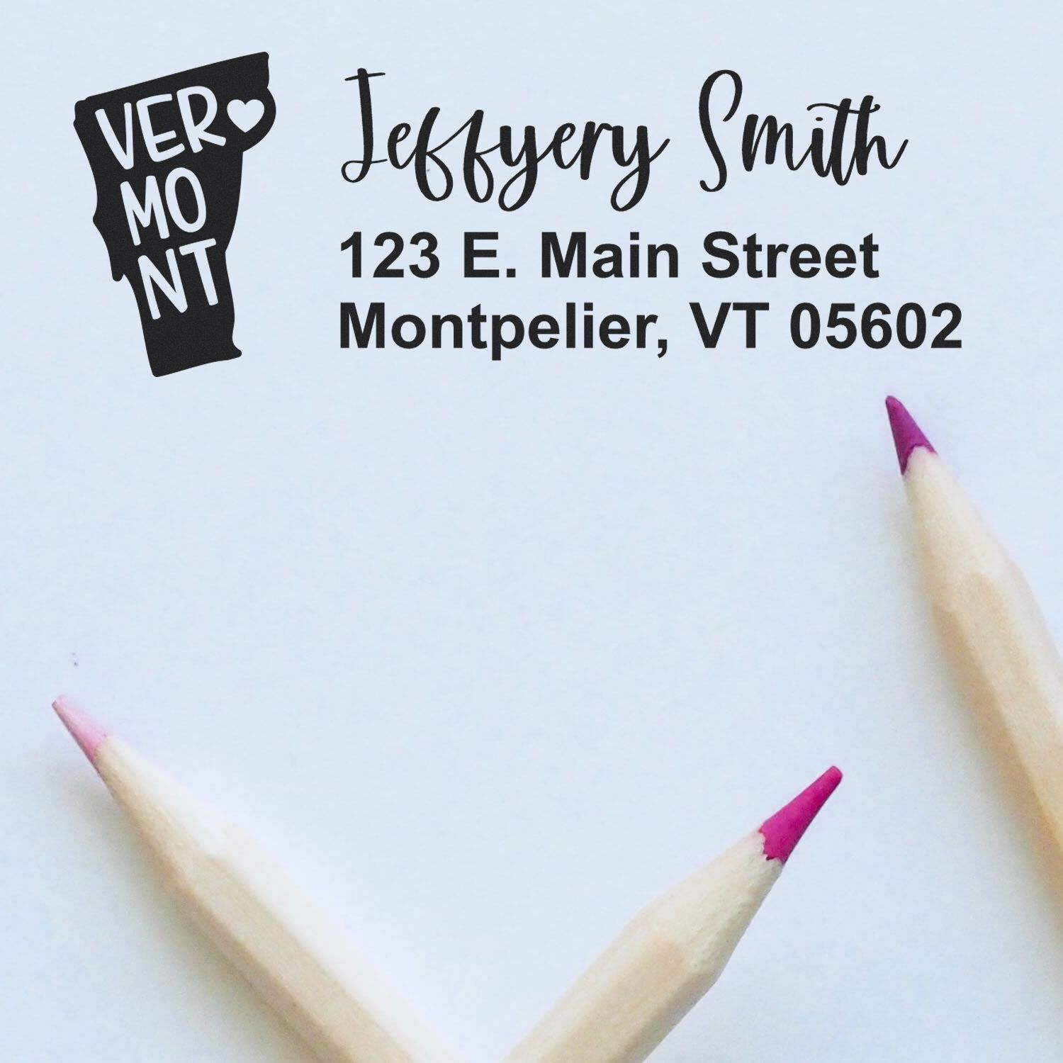 Custom Vermont address rubber stamp with name, city, and ZIP code for personalized mailing and business correspondence.