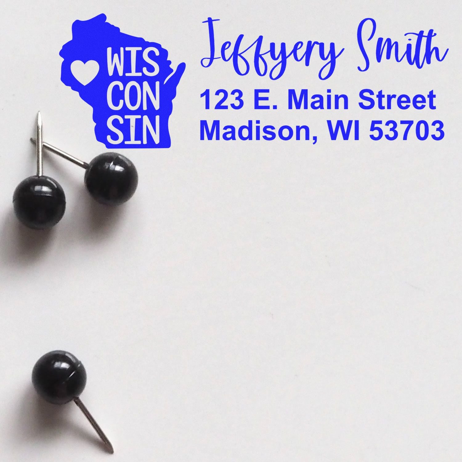 Personalized Wisconsin return address rubber stamp with state outline, heart icon, and Jeffery Smith address in Madison, WI.
