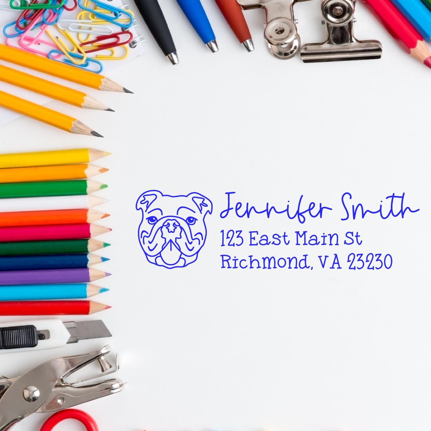 Personalized bulldog address rubber stamp with name and Richmond, VA address, shown with stationery supplies.