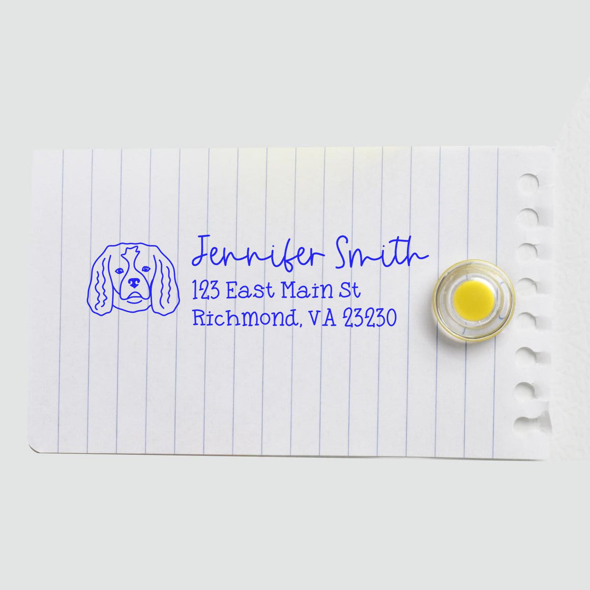 Custom dog return address rubber stamp for Jennifer Smith, 123 East Main St, Richmond, VA 23230 on lined note paper.