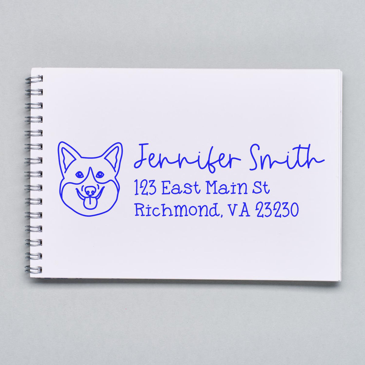 Custom dog return address rubber stamp on notebook, featuring Jennifer Smith name and Richmond, VA mailing address.