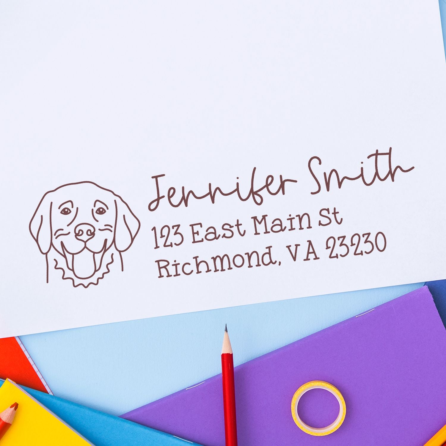 Custom return address rubber stamp with dog logo for Jennifer Smith, 123 East Main St, Richmond, VA 23230.
