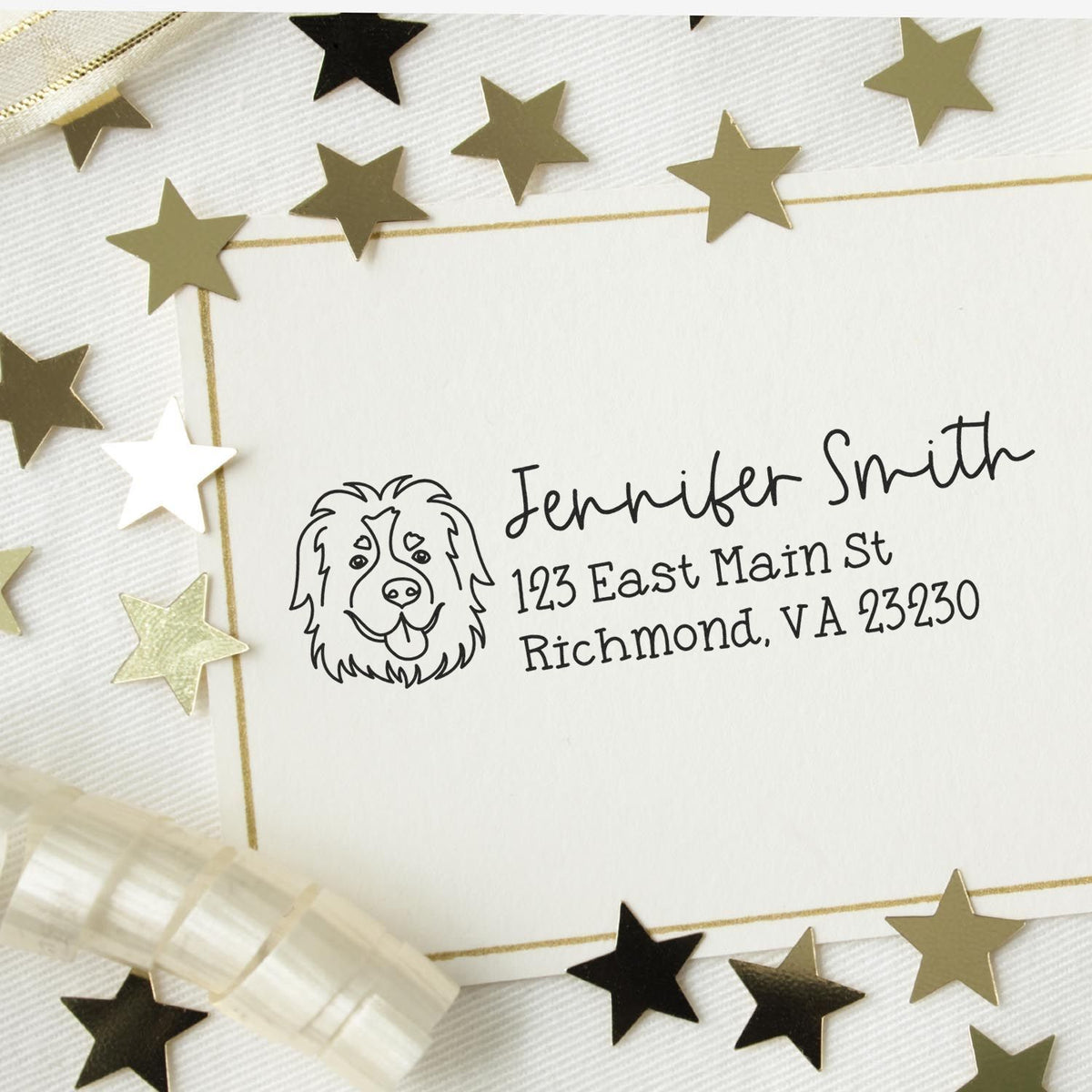 Custom dog return address rubber stamp on envelope with name and Richmond, VA address, surrounded by gold star confetti.