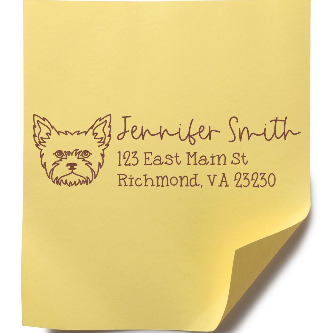 Custom rubber address stamp with dog logo for Jennifer Smith, 123 East Main St, Richmond, VA 23230 on yellow paper.