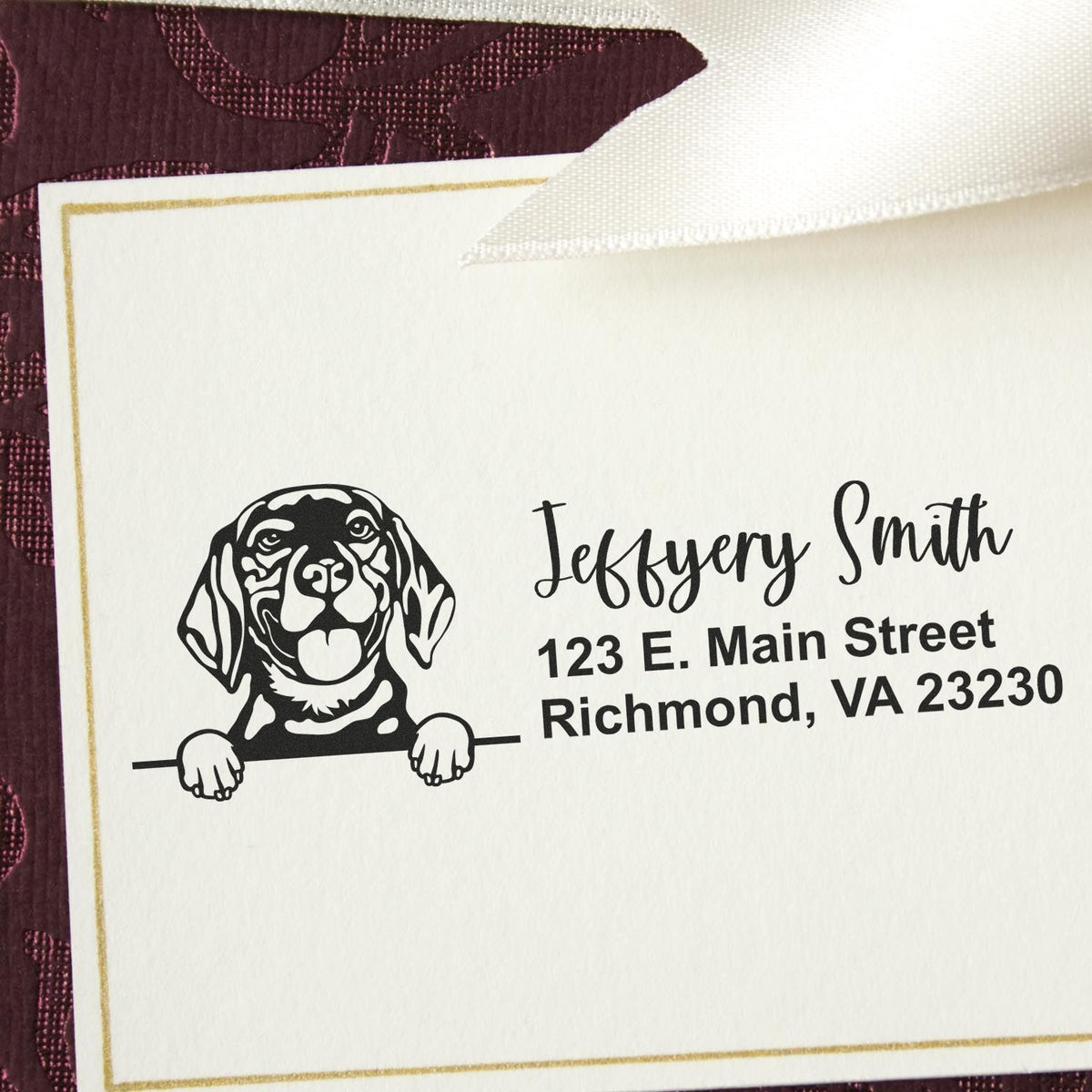 Custom rubber address stamp with dog logo and Jeffery Smith Richmond, VA return address on stationery.