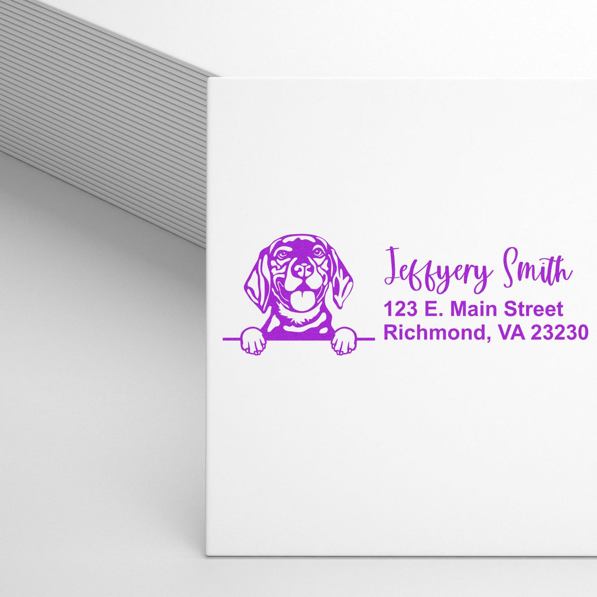Custom return address rubber stamp with dog illustration for Jeffery Smith, 123 E. Main Street, Richmond, VA 23230.