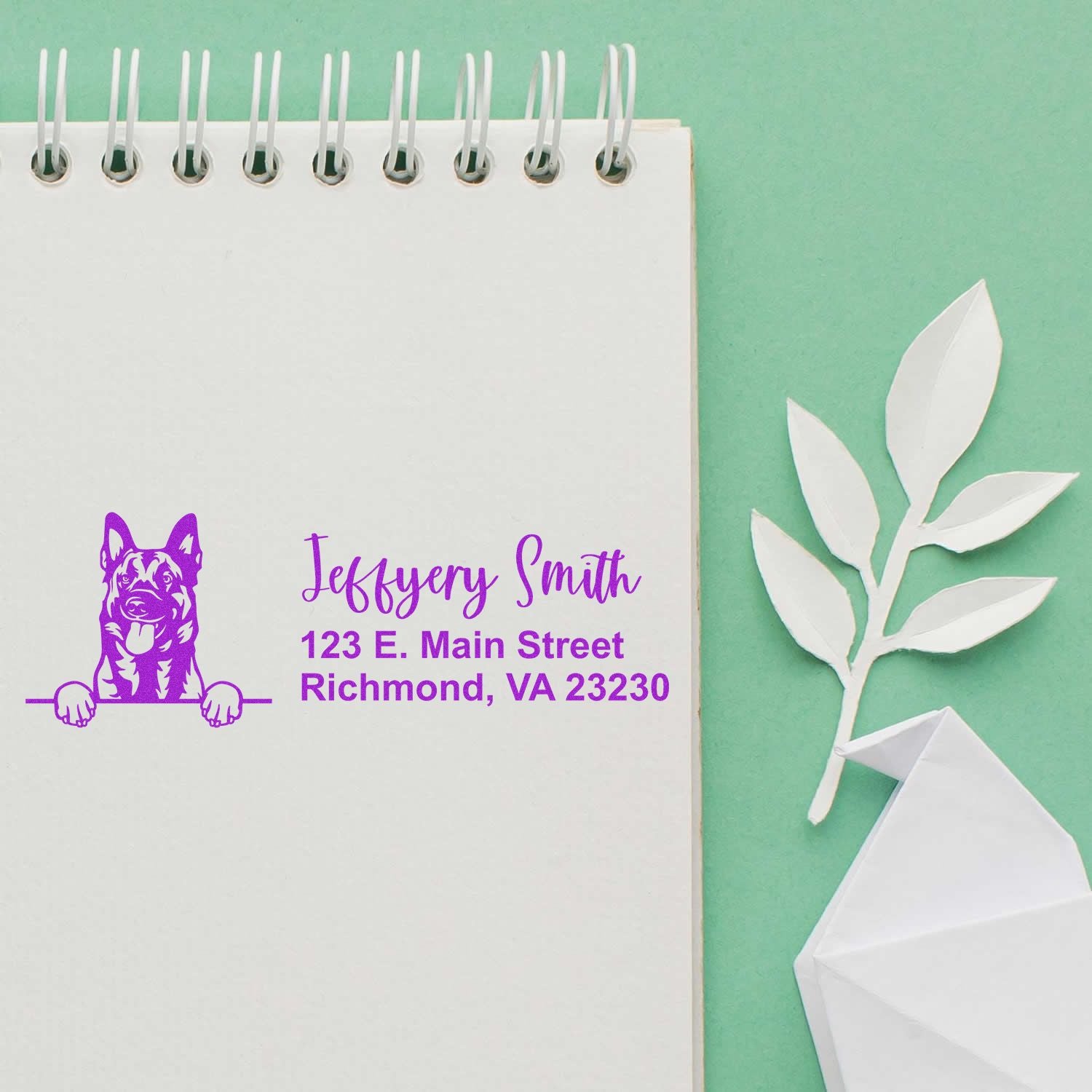 Custom dog address rubber stamp on notebook, featuring name and Richmond, VA address for pet business branding.