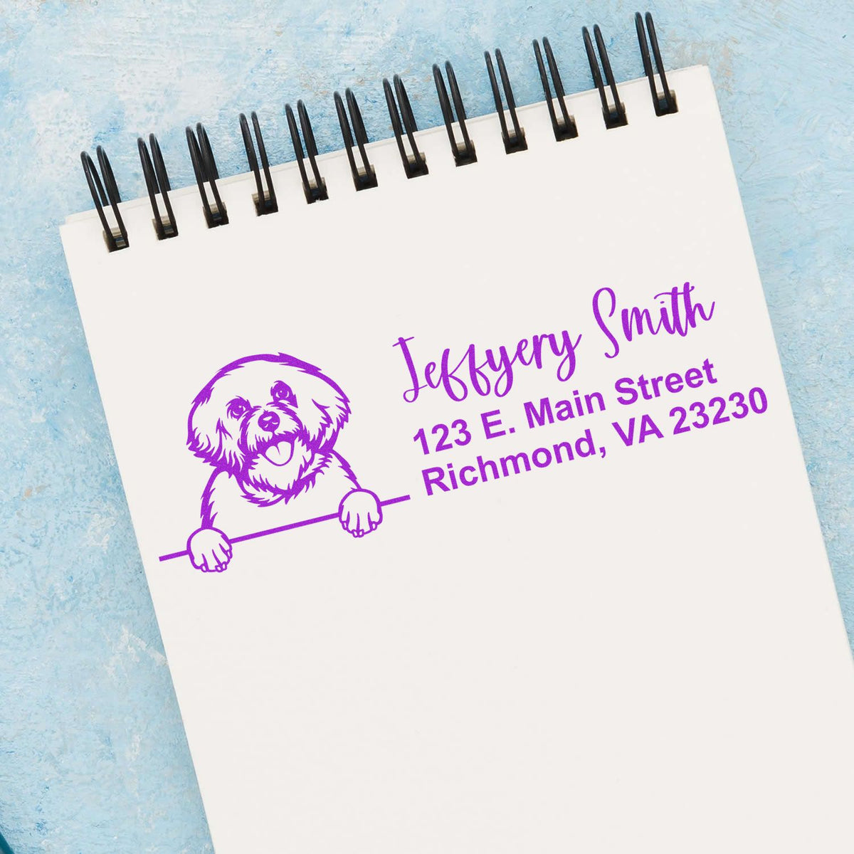 Custom dog return address rubber stamp with name and Richmond, VA address on a notepad