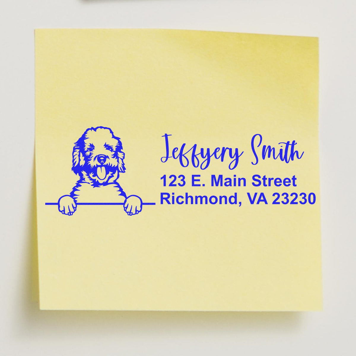 Custom dog return address rubber stamp with name and address on a yellow note, featuring a personalized pet illustration for mailing.