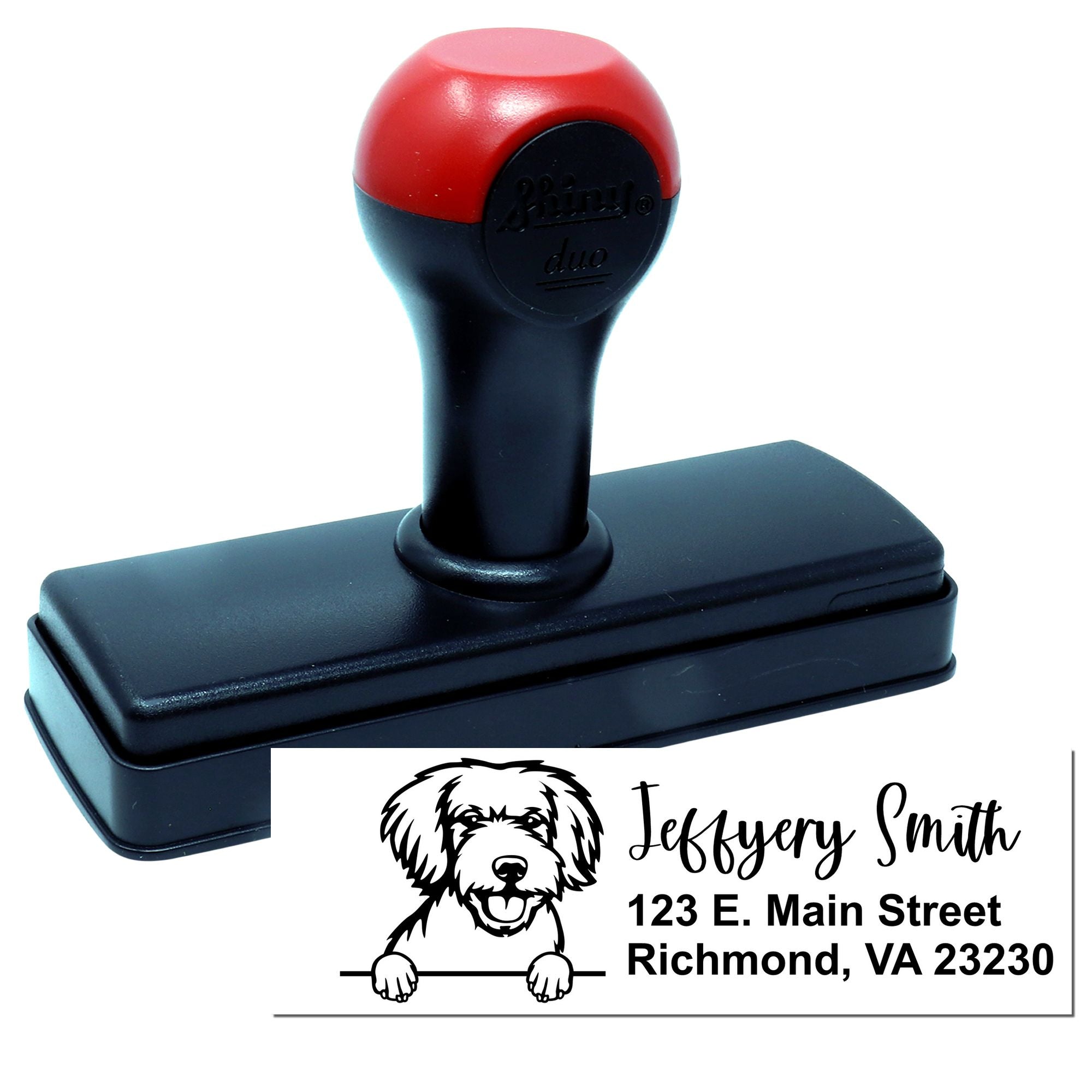 Custom self-inking rubber stamp with dog logo and address imprint for business branding and mailing.