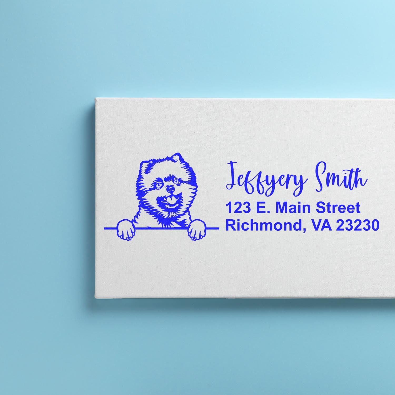 Custom dog return address rubber stamp with name and Richmond, VA address on a white box.