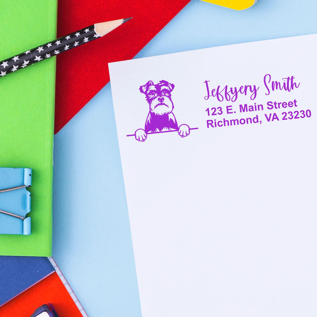 Custom return address rubber stamp with dog logo and purple imprint for personalized home or business mailings.