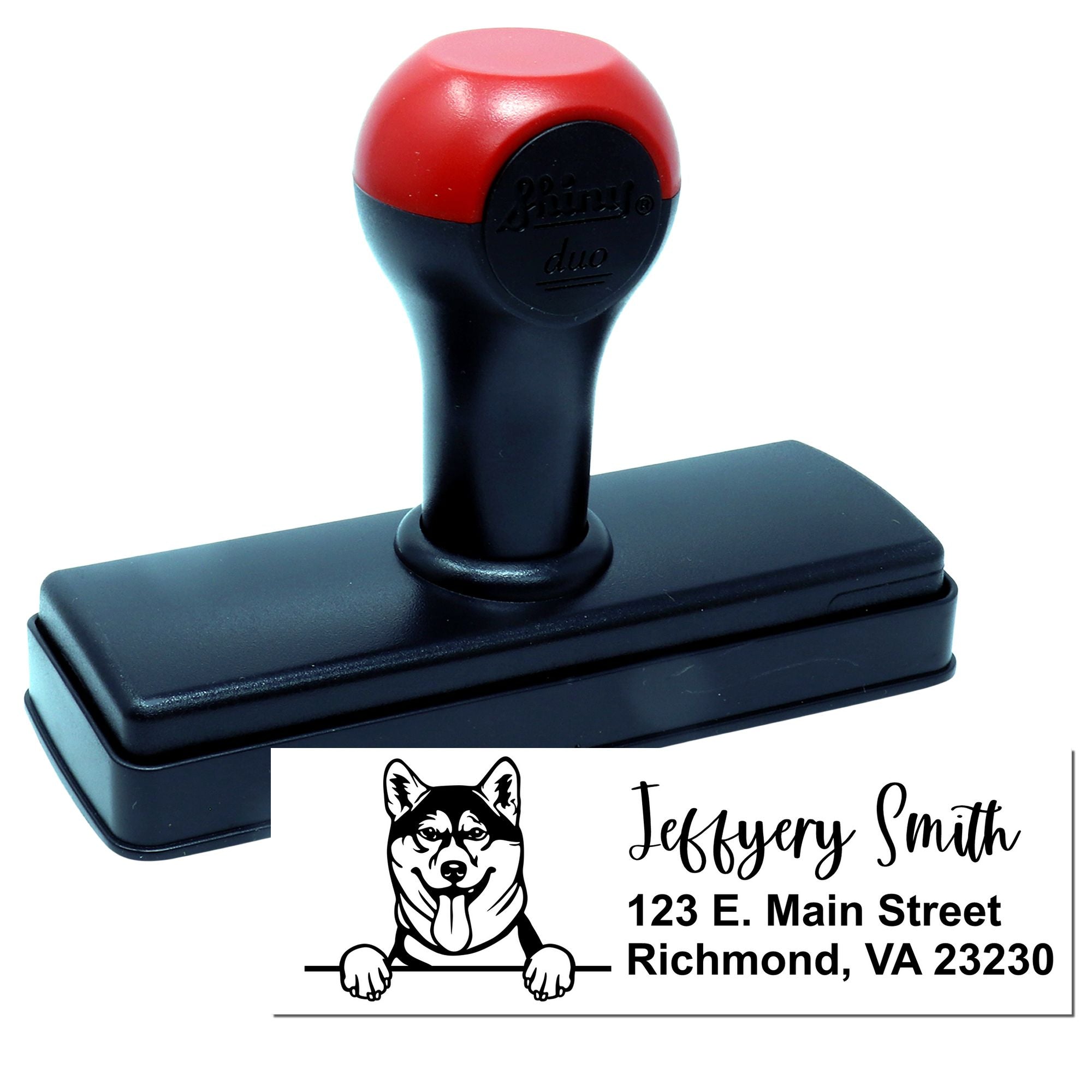 Custom self-inking rubber address stamp with dog logo and return address for personalized business mailings.
