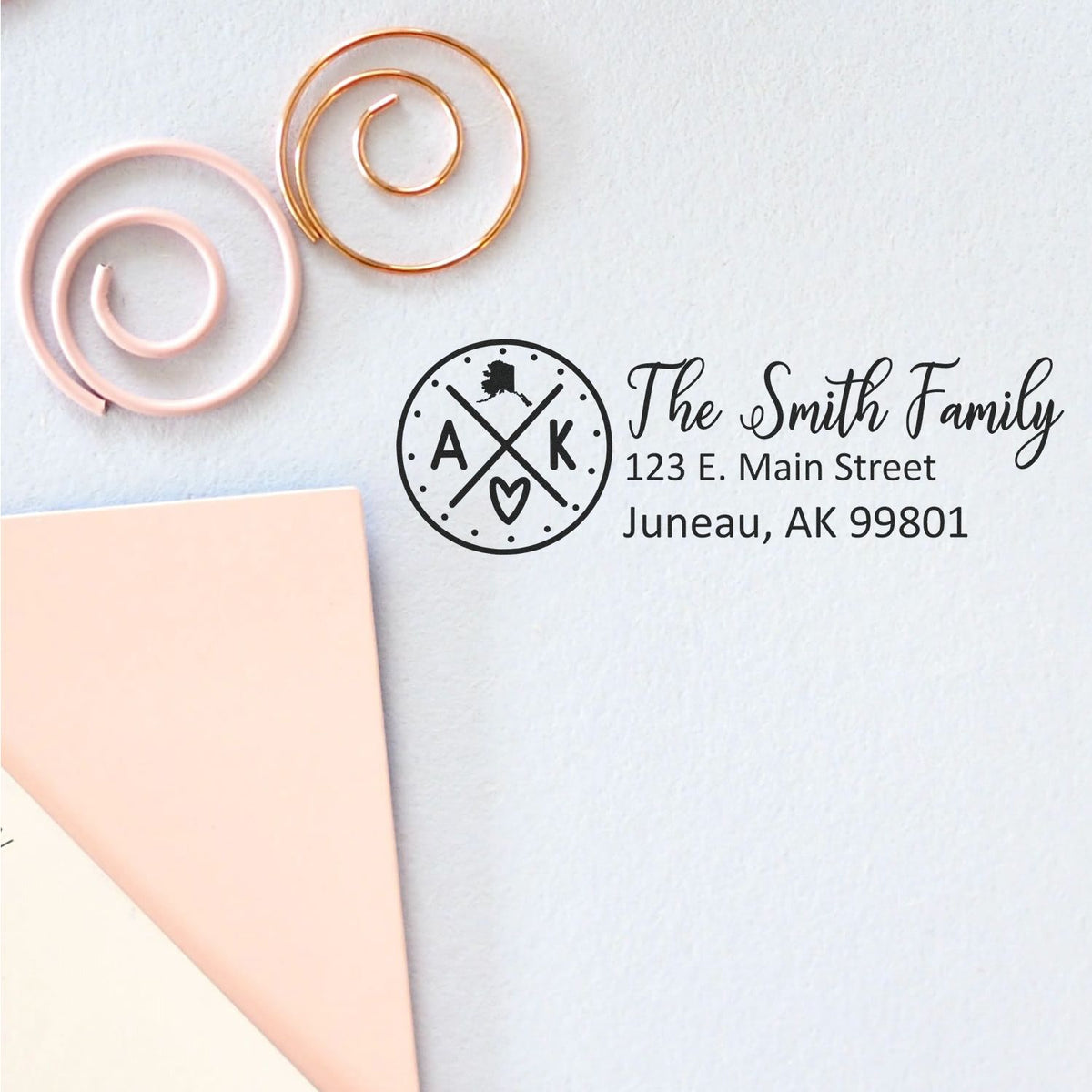 Personalized return address rubber stamp with family monogram and Juneau, AK address for envelopes.