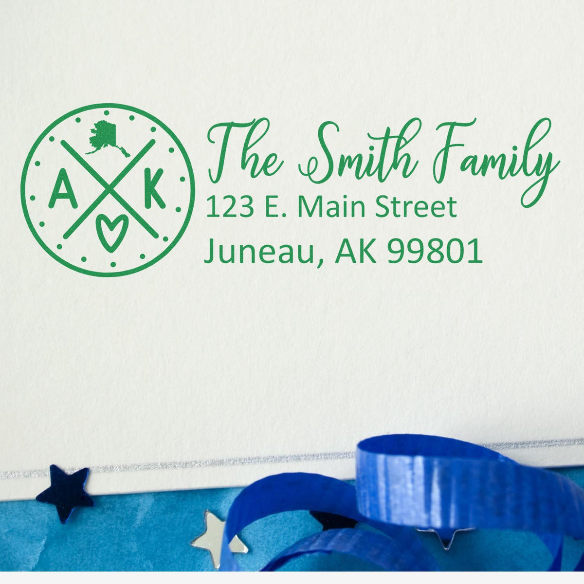 Personalized return address rubber stamp for The Smith Family, Juneau, AK 99801, with Alaska monogram design.