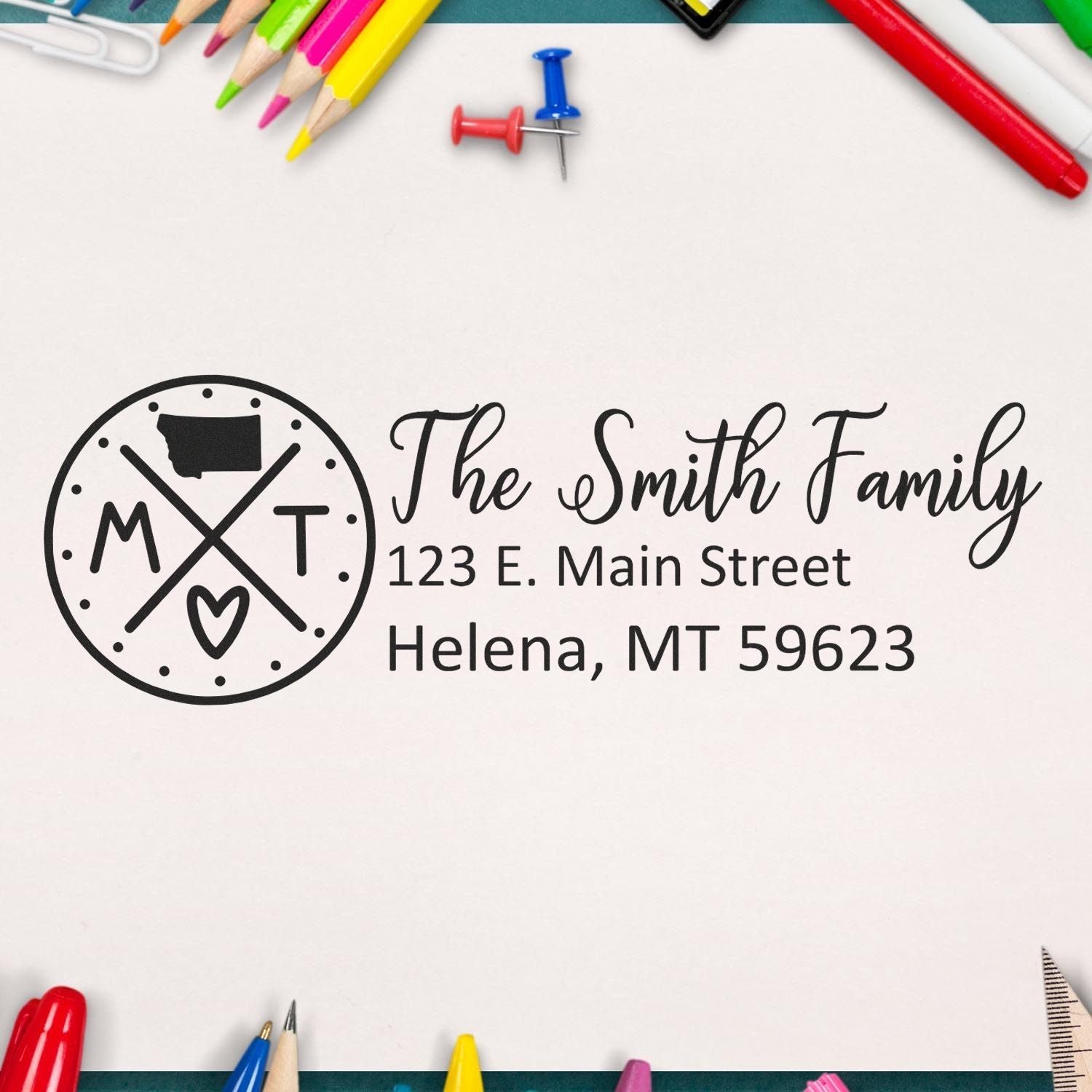 Personalized rubber return address stamp for The Smith Family, featuring logo and Helena, MT 59623 address.