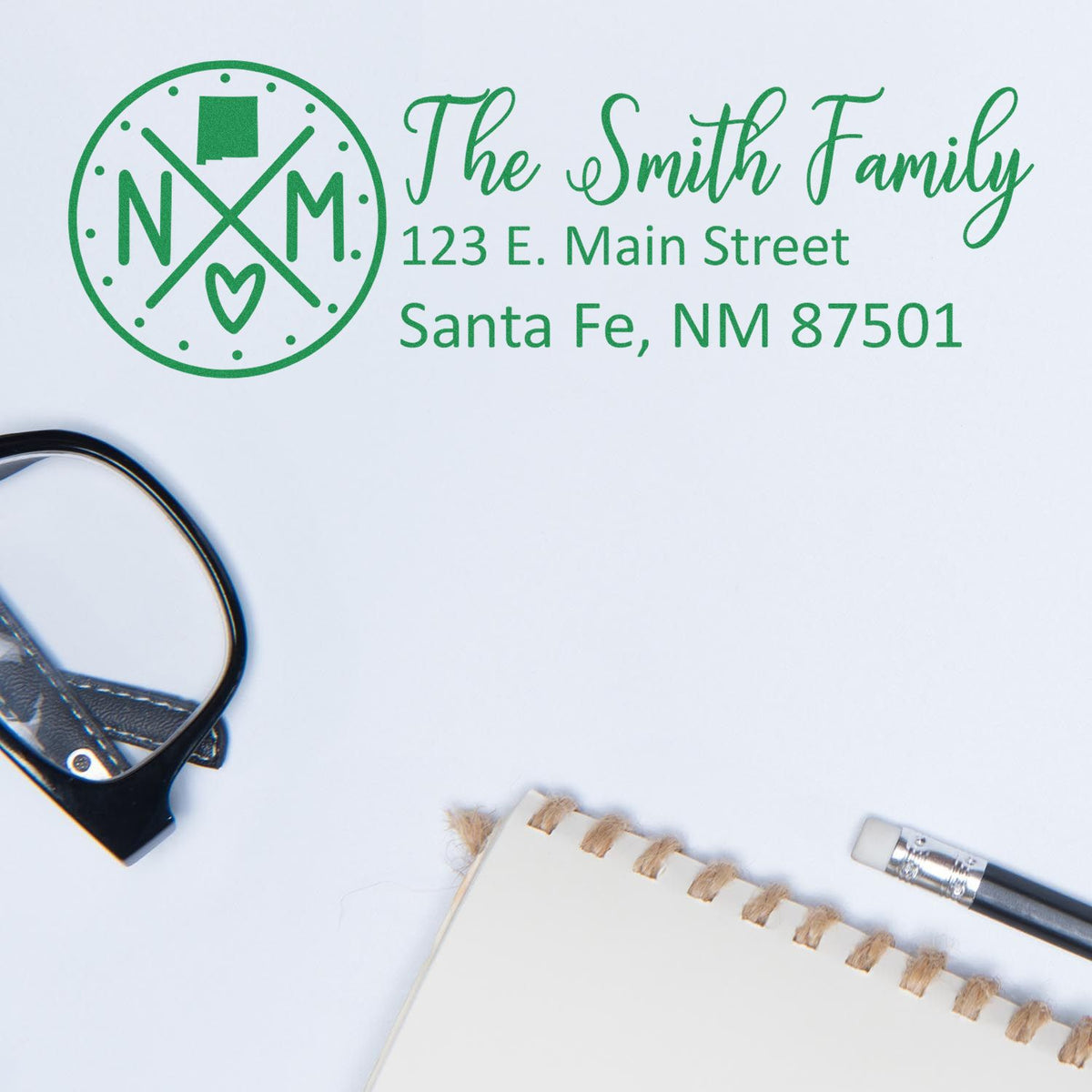 Custom return address rubber stamp for The Smith Family with monogram logo, 123 E. Main Street, Santa Fe, NM 87501