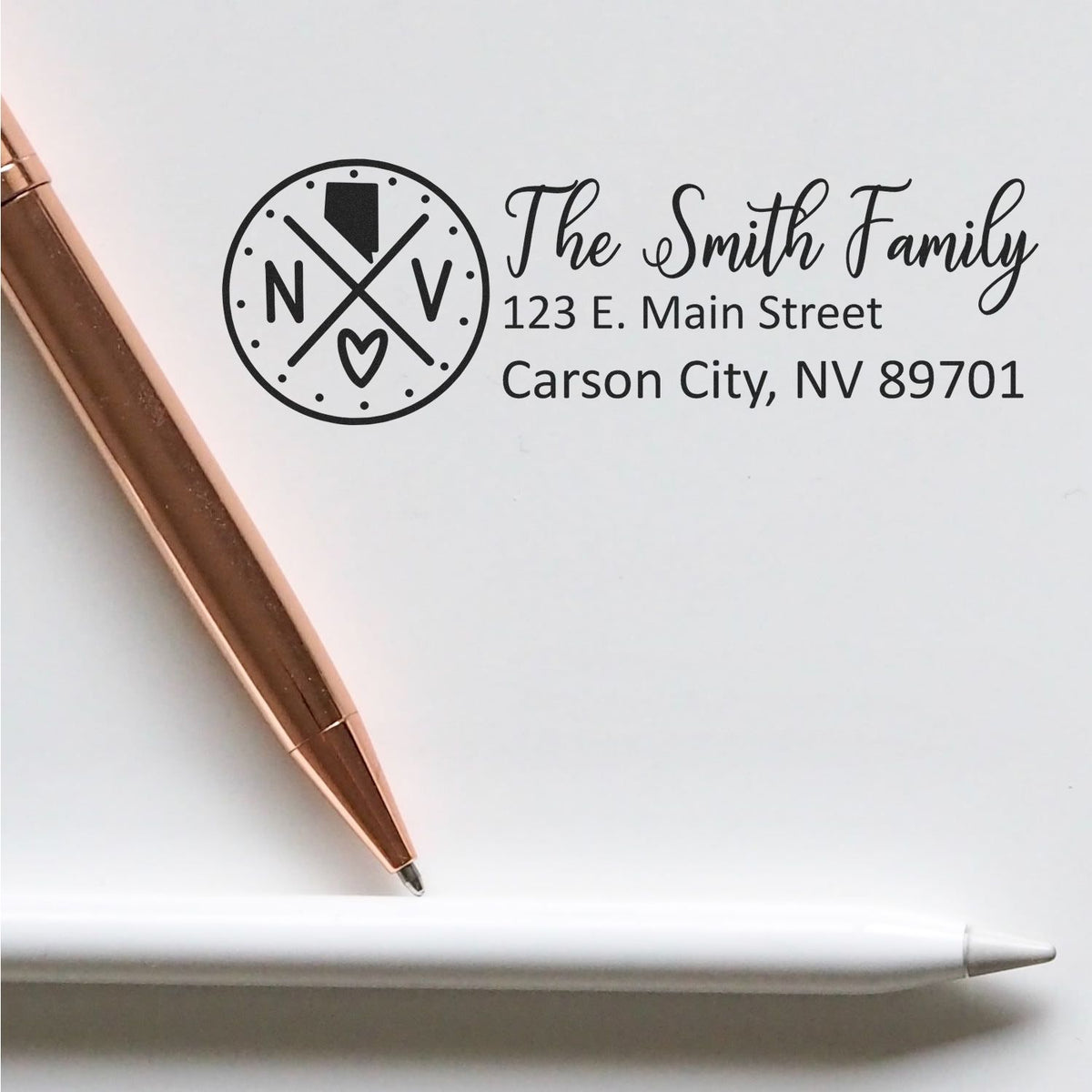 Custom rubber stamp return address for The Smith Family with monogram logo and Carson City, NV mailing details