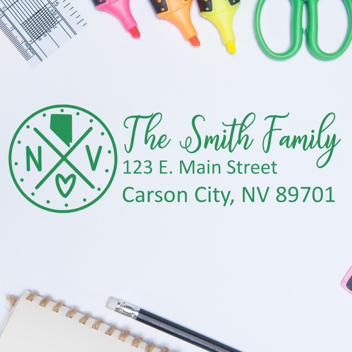 Custom return address rubber stamp for The Smith Family, with 123 E. Main Street, Carson City, NV 89701 in green.