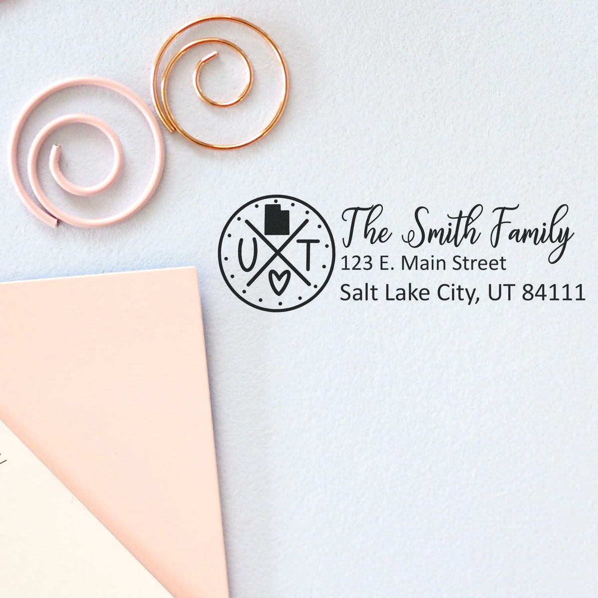 Personalized family address rubber stamp for envelopes, featuring monogram, name, and mailing address.