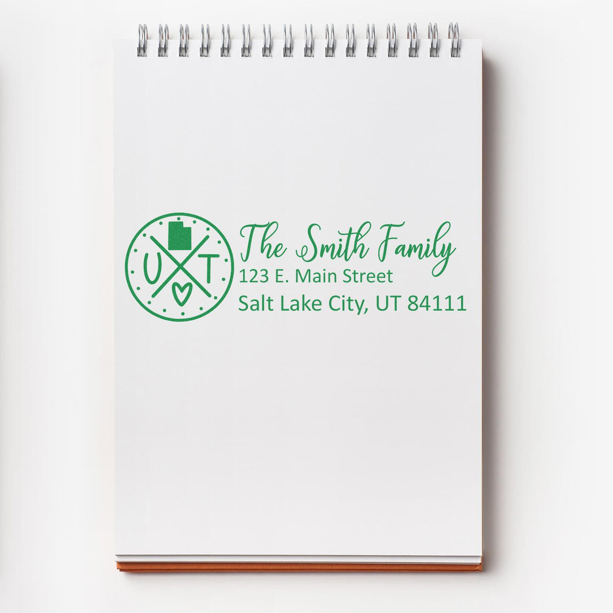 Custom return address rubber stamp for The Smith Family, Salt Lake City, UT 84111, with monogram logo.