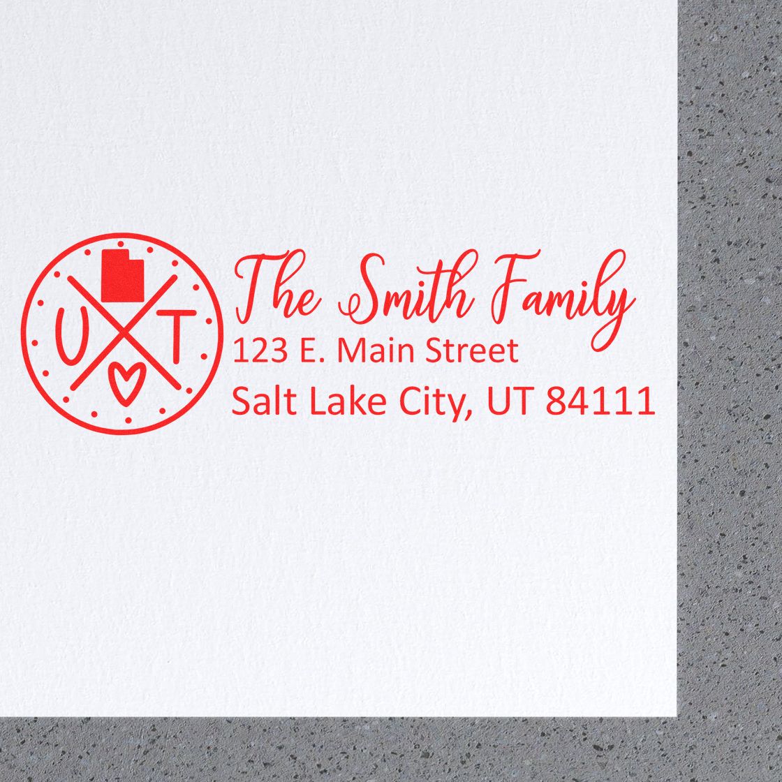 Personalized family return address rubber stamp with monogram and Salt Lake City, UT address in red ink.
