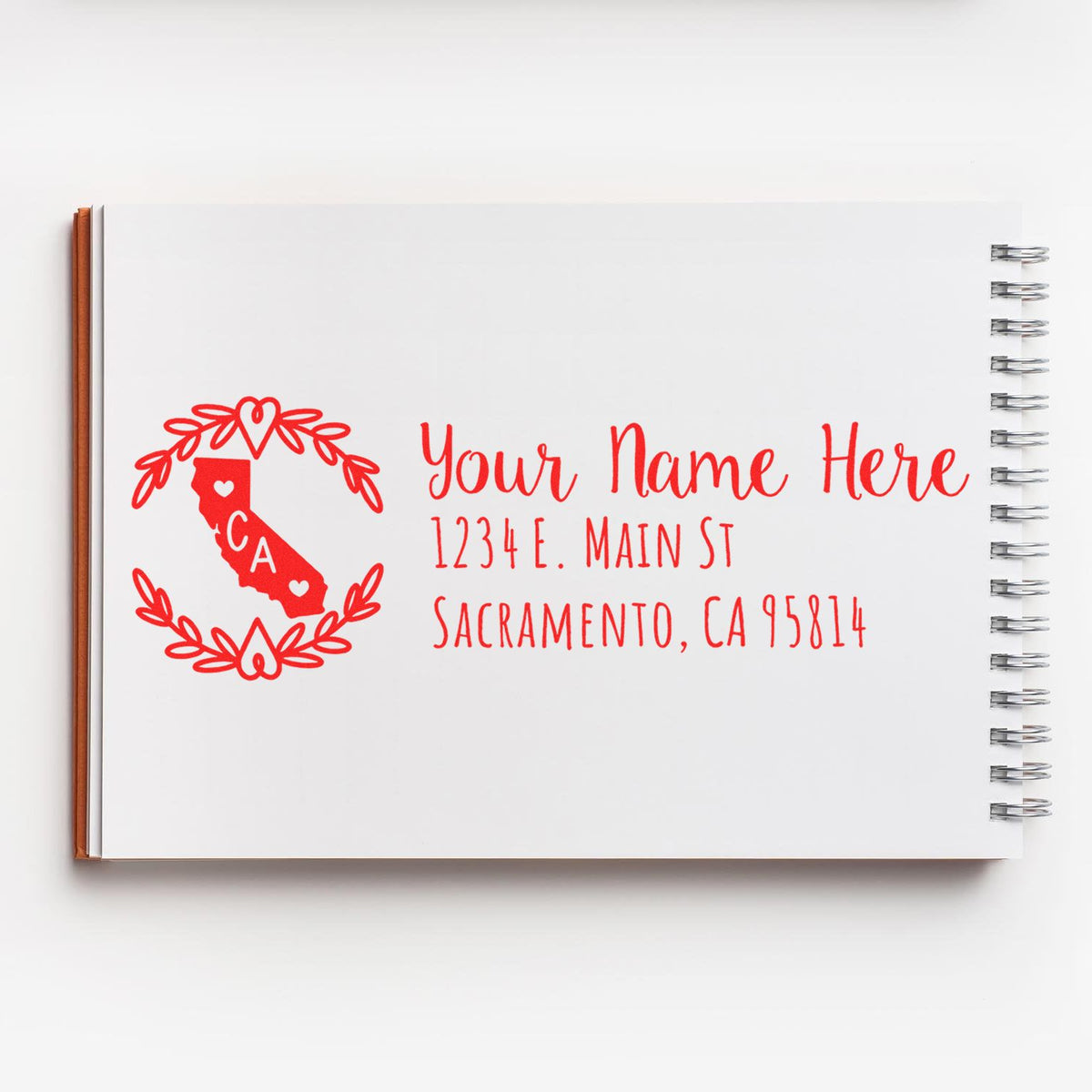 Personalized California return address rubber stamp with wreath and state silhouette for custom mailing labels.