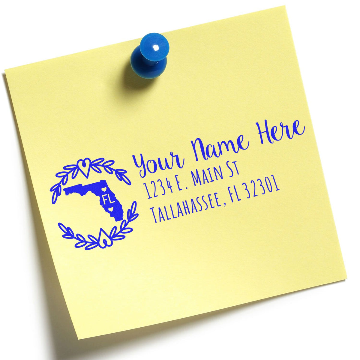 Personalized Florida return address rubber stamp on a yellow note, showing a name and Tallahassee, FL mailing address.