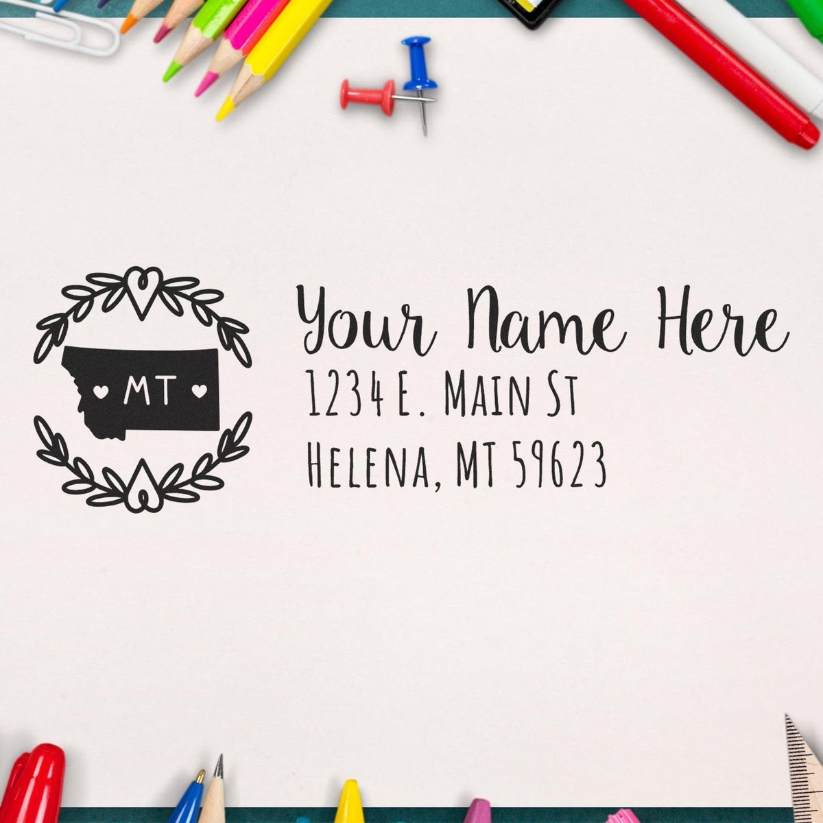Personalized Montana address rubber stamp with floral wreath, custom name and return address imprint for envelopes.
