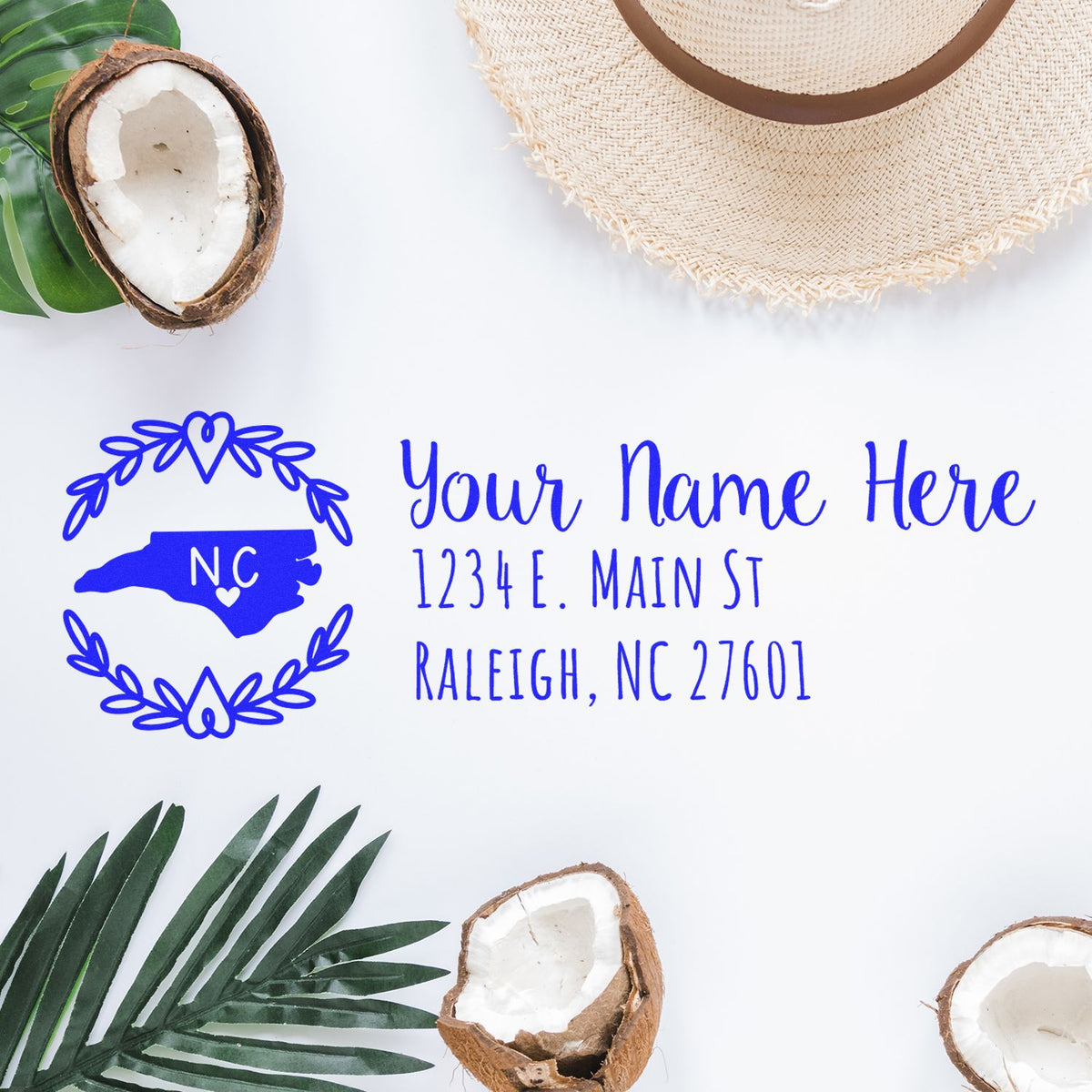 Personalized North Carolina return address rubber stamp with name and Raleigh address on a tropical-themed mockup.