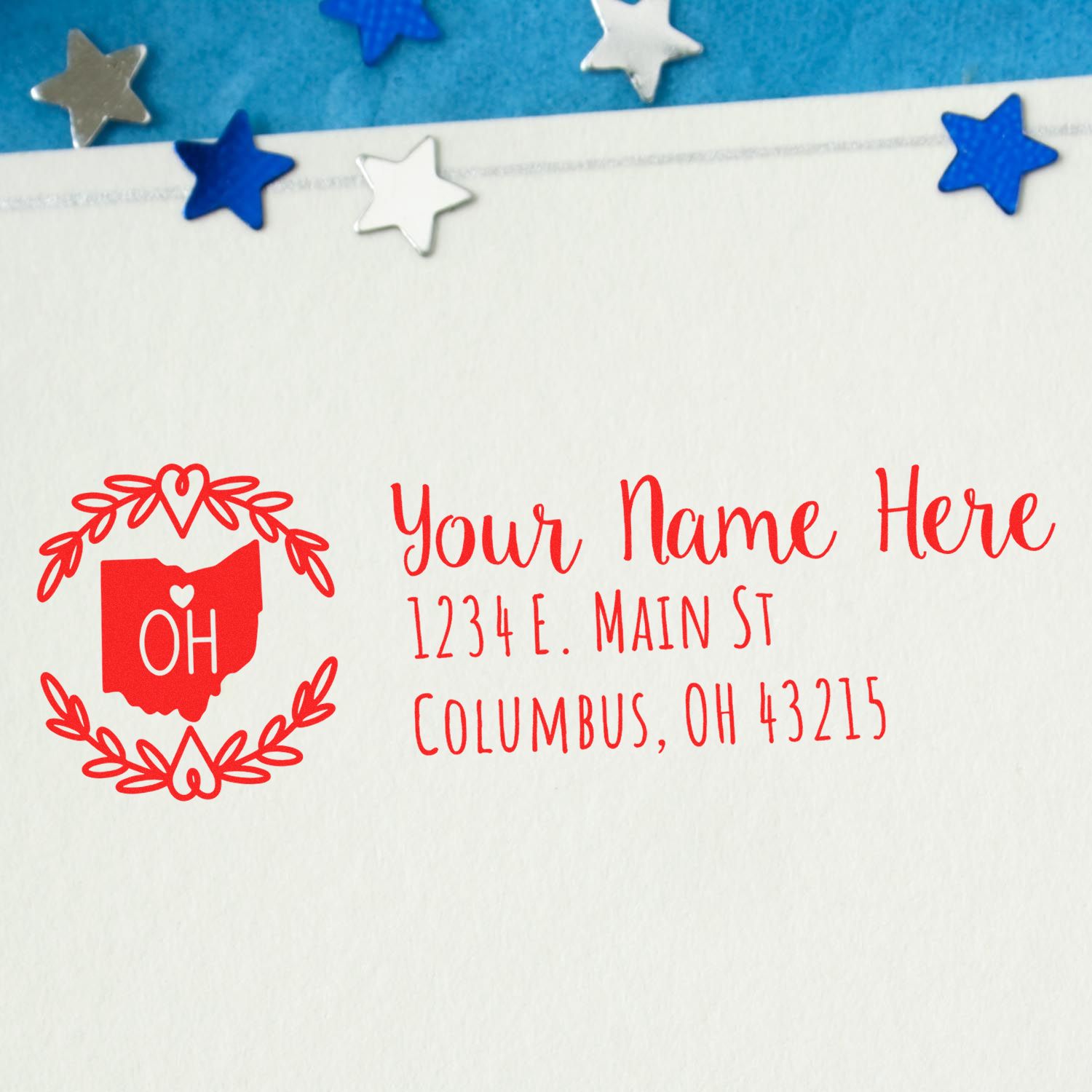 Custom Ohio return address rubber stamp with name and address imprint on envelope, featuring decorative stars and state outline.