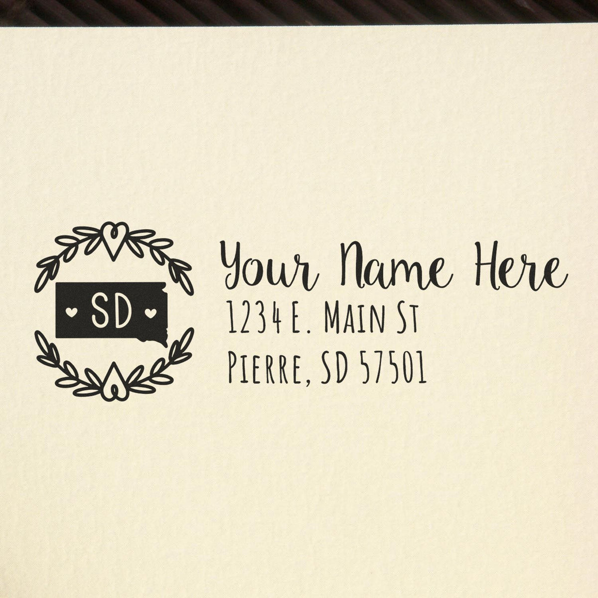 Custom South Dakota return address rubber stamp with floral state wreath, name placeholder, and sample mailing address.