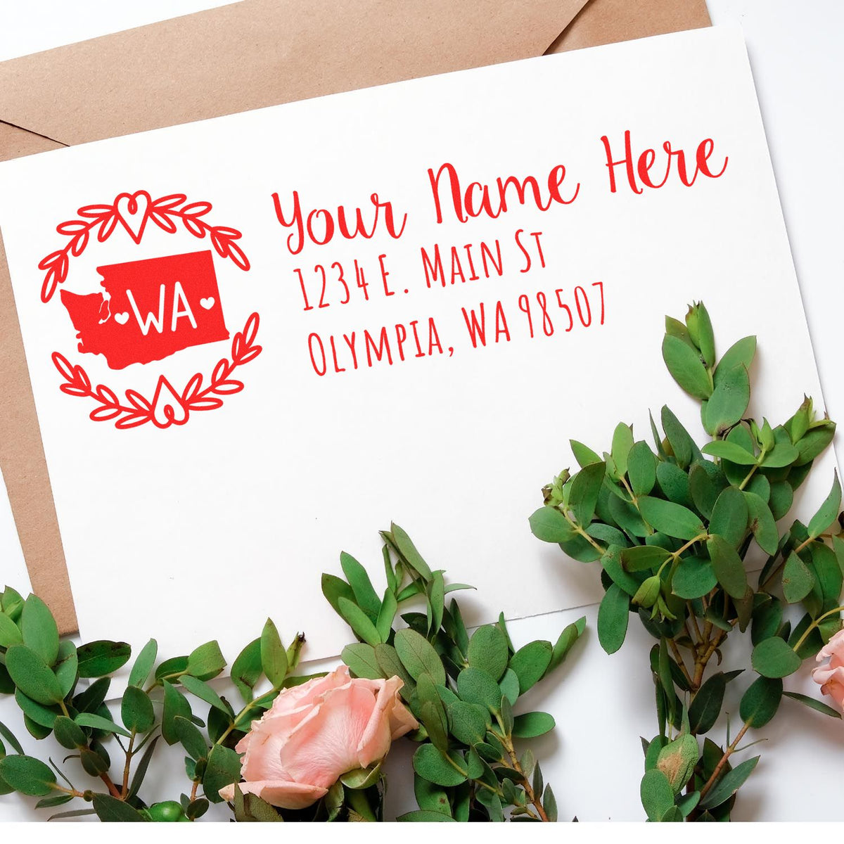 Custom return address rubber stamp for Washington mail, featuring a floral wreath, WA state icon, name, and Olympia address.