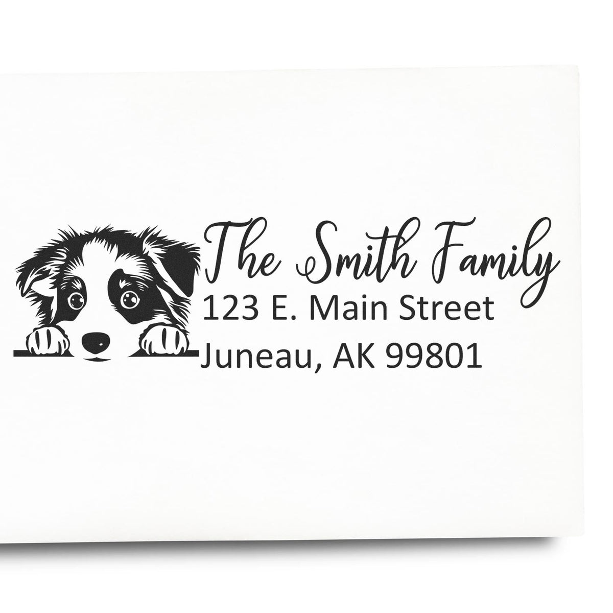 Personalized rubber address stamp with puppy dog design for The Smith Family, 123 E. Main Street, Juneau, AK 99801.