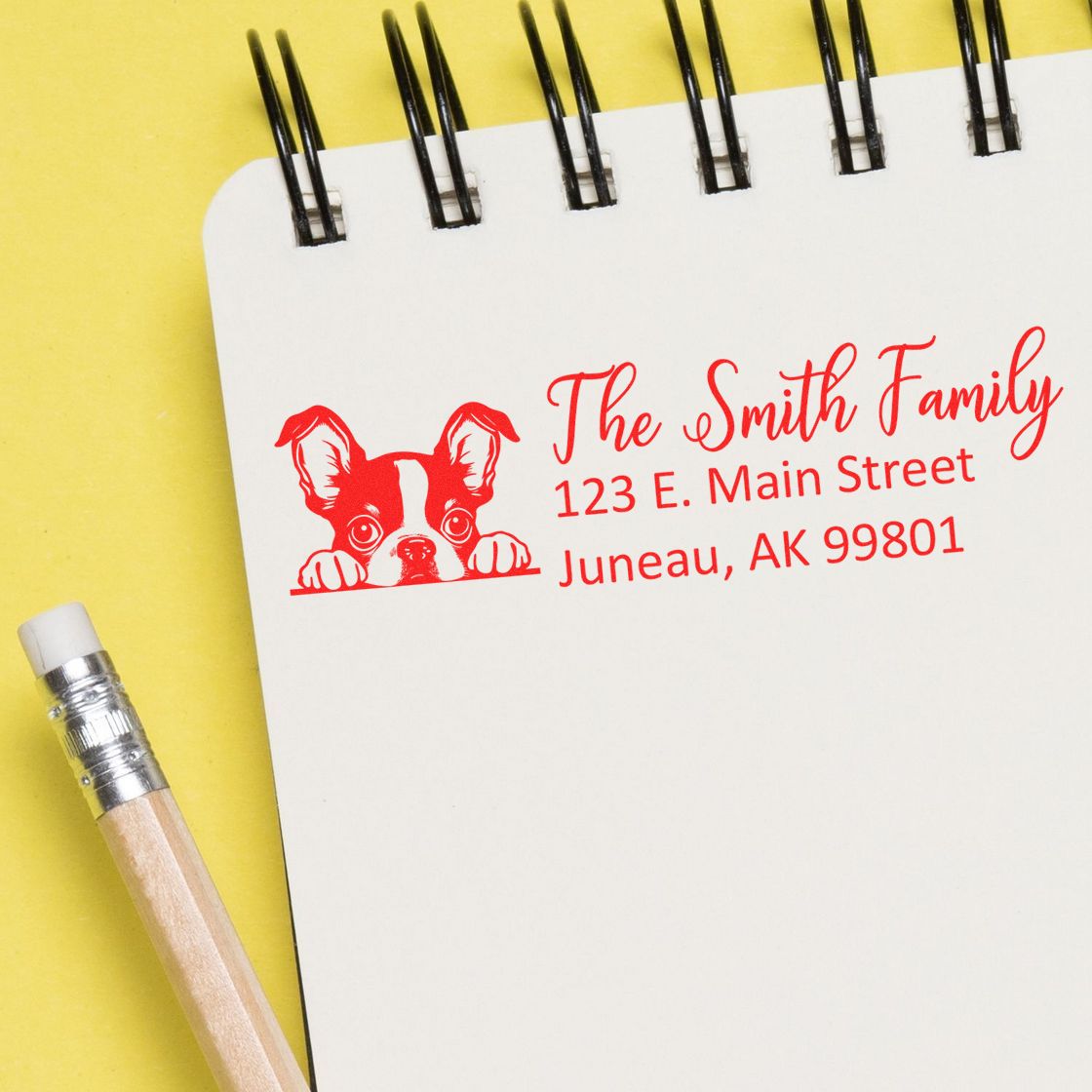 Personalized address rubber stamp with dog logo, showing The Smith Family return address in Juneau, AK.