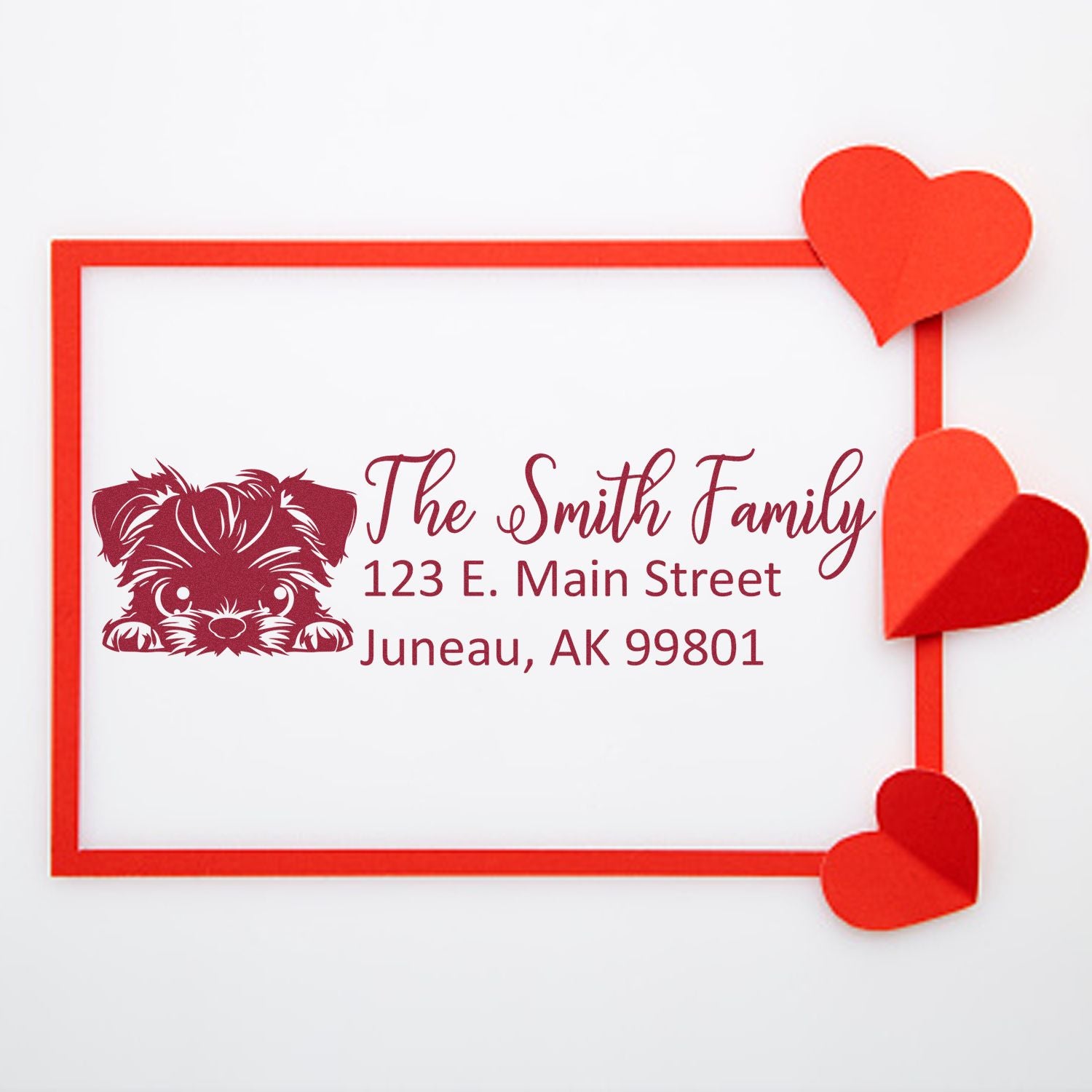 Custom family return address rubber stamp with dog illustration, heart frame, and Juneau, AK address