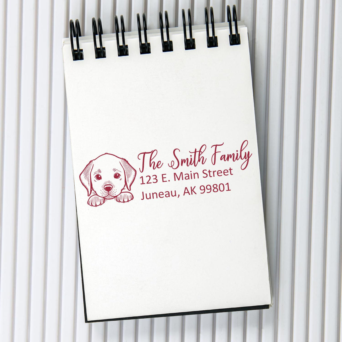 Custom rubber address stamp with puppy design and family return address for The Smith Family, Juneau, AK.