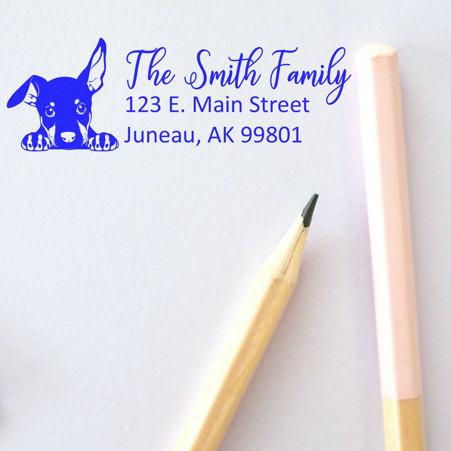 Custom return address rubber stamp with dog design for The Smith Family, Juneau, AK 99801