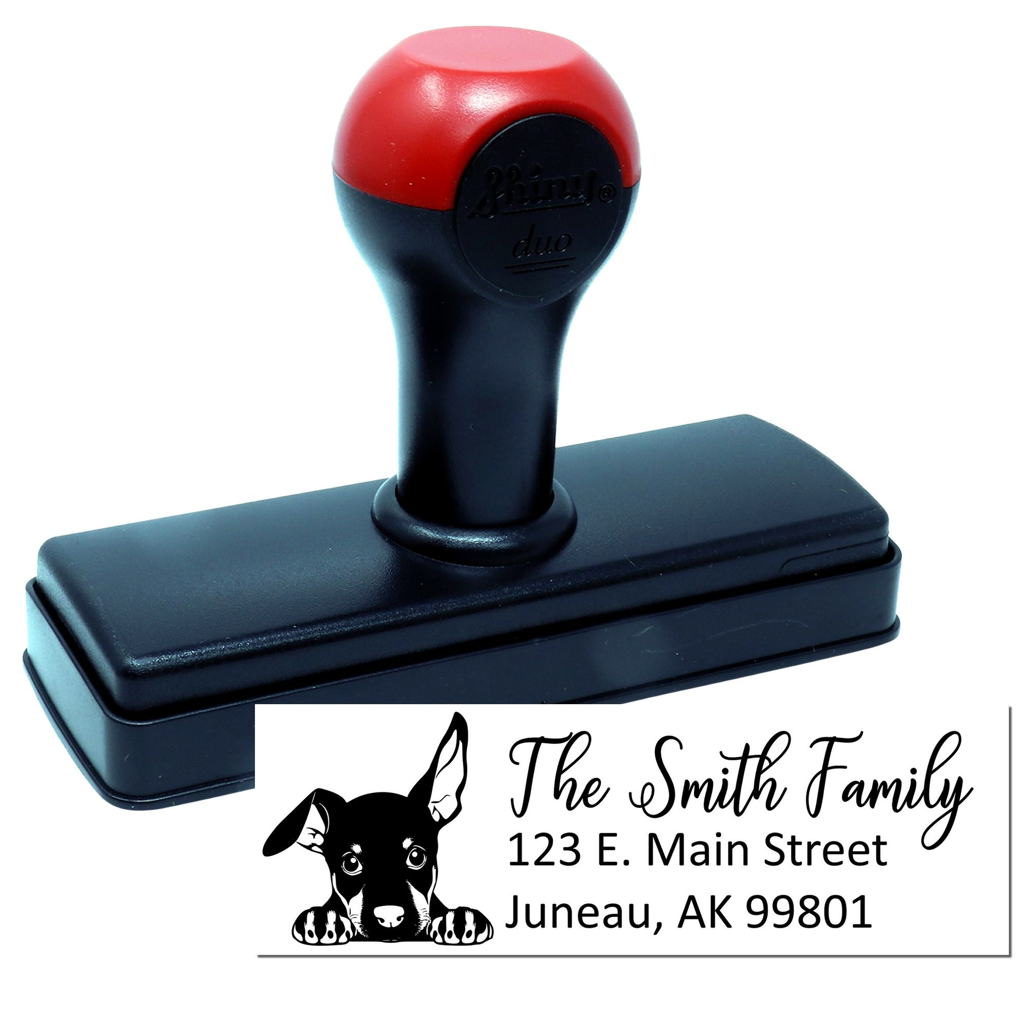 Custom self-inking rubber address stamp with dog design and Smith family return address for personalized mailing.