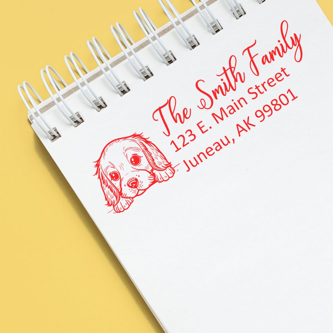 Custom dog address rubber stamp with family name and address, ideal for personalized mailing and return labels.