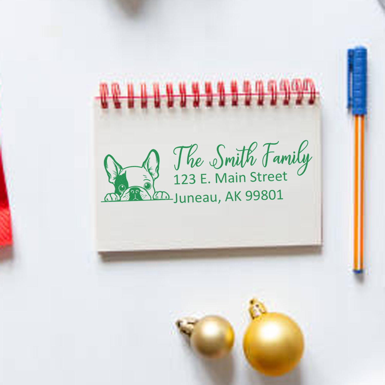 Custom return address rubber stamp with dog illustration for The Smith Family, 123 E. Main Street, Juneau, AK.