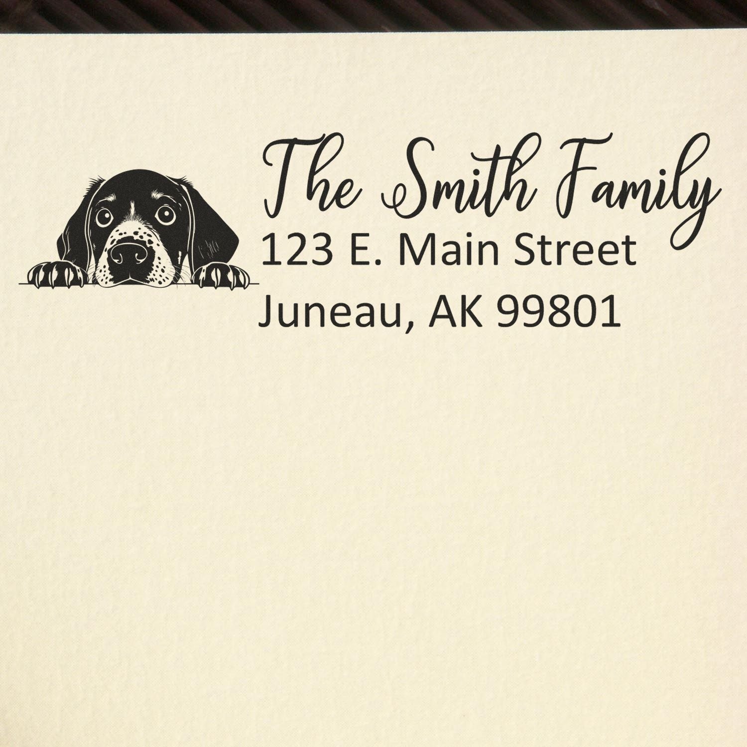 Custom dog return address rubber stamp for The Smith Family, 123 E. Main Street, Juneau, AK 99801.
