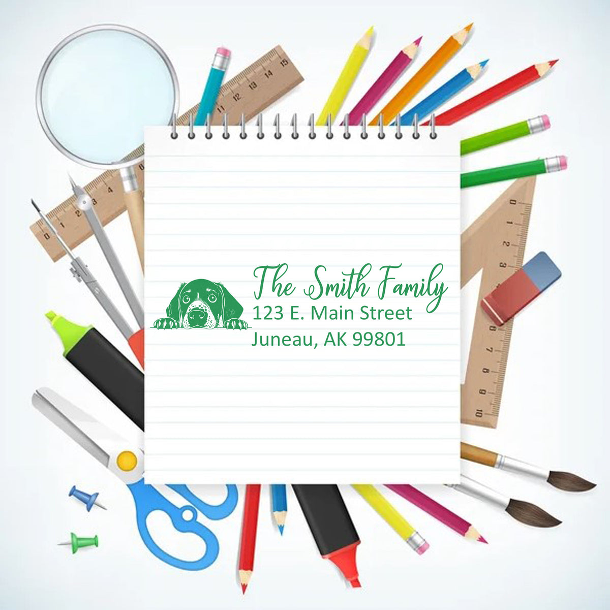 Personalized return address rubber stamp for The Smith Family with dog logo, Juneau AK address, and school supplies border.