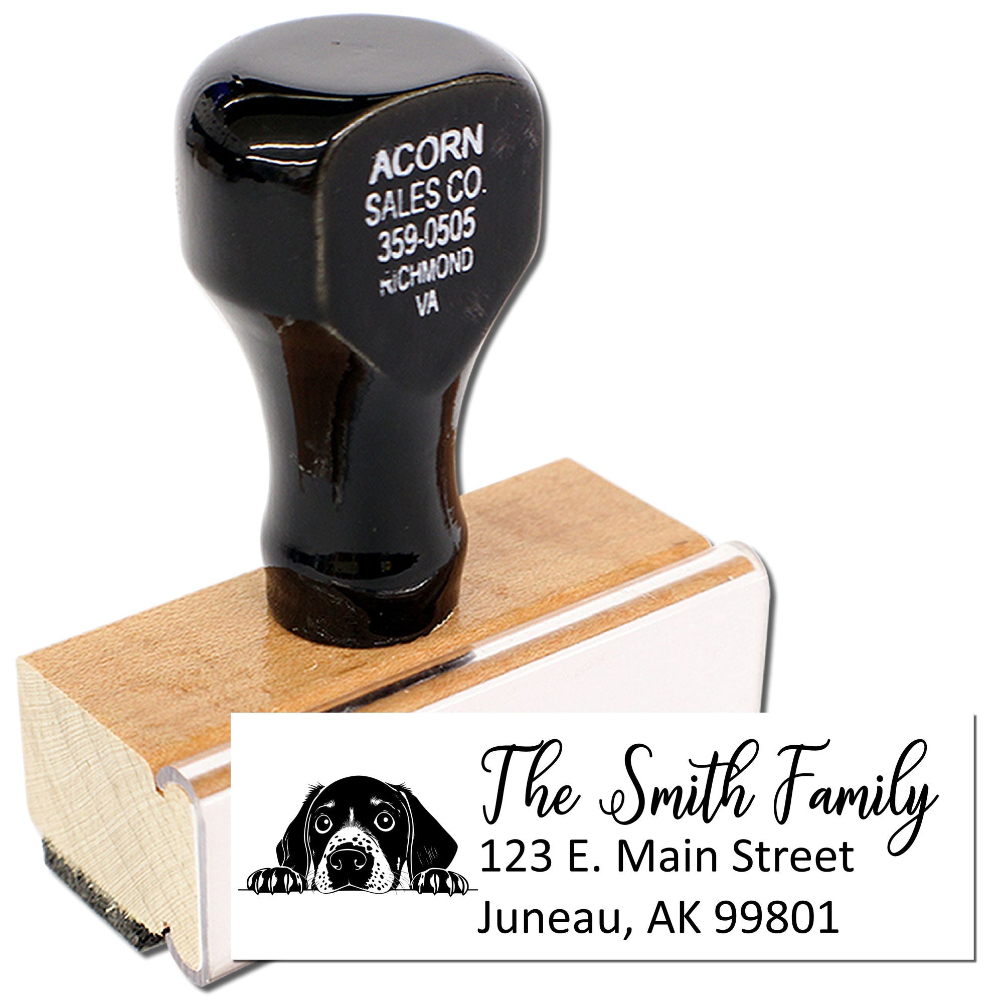Custom rubber address stamp with dog logo, family name, and mailing address for envelopes.