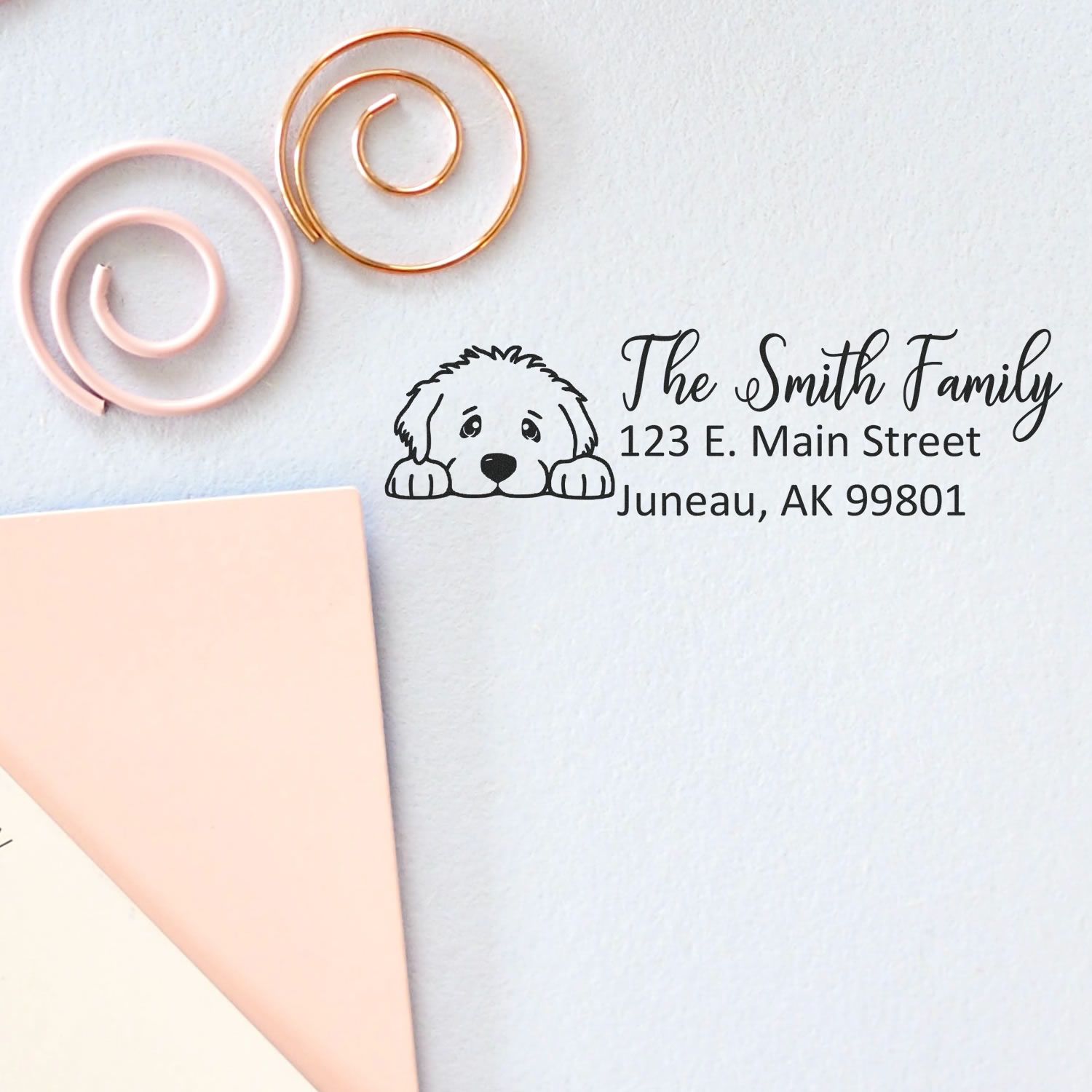 Personalized dog return address rubber stamp with family name and address for envelopes, mail, and pet-themed stationery.