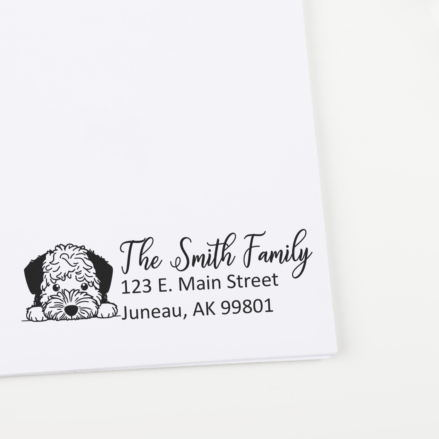 Custom return address rubber stamp with dog illustration for The Smith Family, Juneau AK.