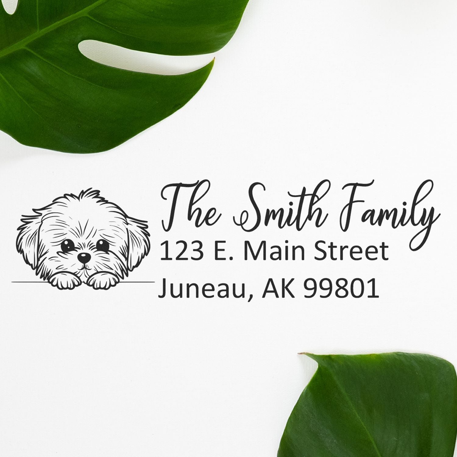 Custom return address rubber stamp for The Smith Family with dog illustration and Juneau, AK address.