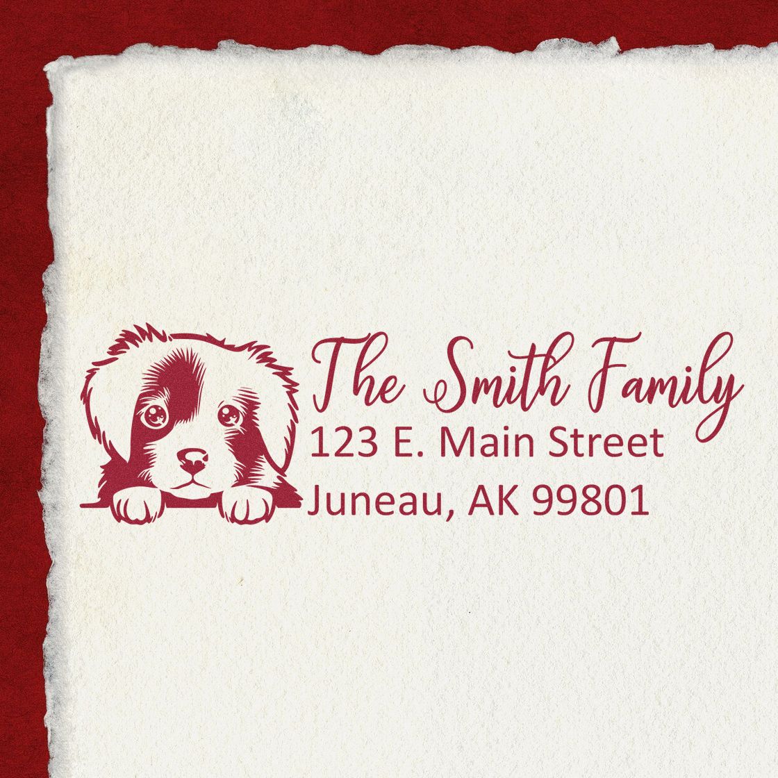 Custom rubber address stamp with dog illustration for The Smith Family, Juneau, AK postal imprint.