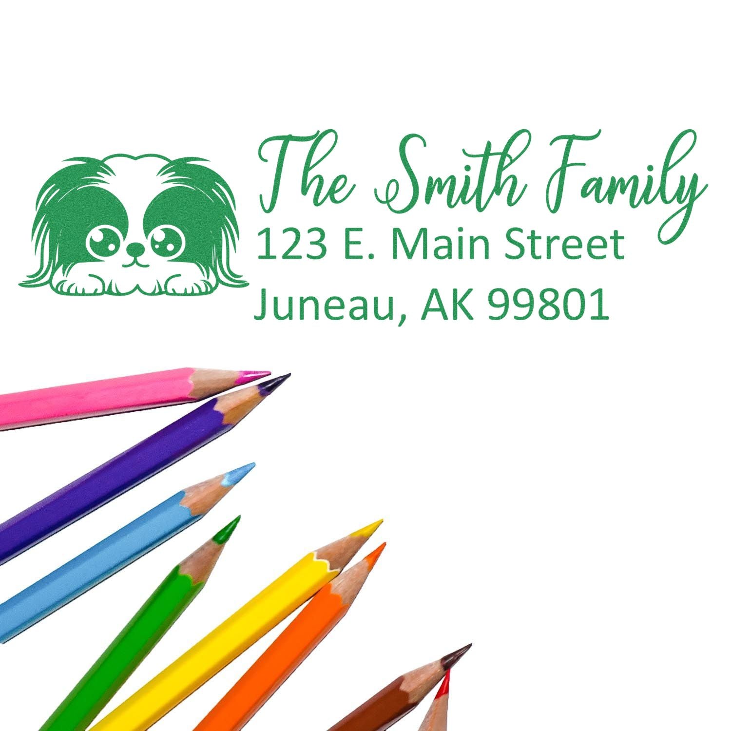 Custom rubber stamp design with dog icon, The Smith Family return address, 123 E. Main Street, Juneau, AK 99801.